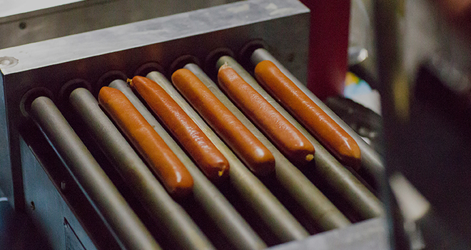 What is the appropriate temperature for a rotating sausage grill?